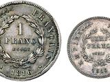 a silver coin with a wreath on the front and a laurel on the back
