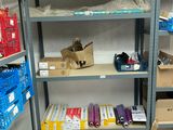 many boxes and boxes on the shelves in the room