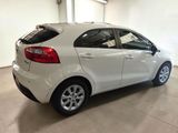 a picture of a white car parked in a garage