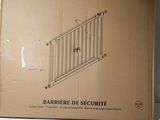 cardboard box with a drawing of a security gate on top of it