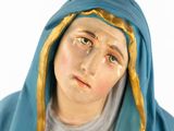 a statue of a woman with a veil on her head
