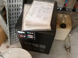 an image of a dirty water heater in a garage