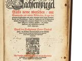 an old book with a black and white image on it