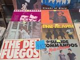 a lot of vinyl records on the table