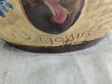a close up of a vase on a table