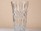 a glass vase that is sitting on a table