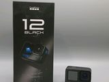 the box of the gopro camera is next to the box of the camera