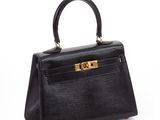 a black leather handbag on a white background