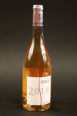 a bottle of wine that is sitting on a table