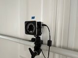 a small camera attached to a pole in a room