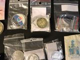 a lot of coins and other items that are on the table