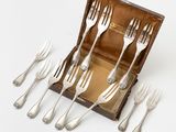 a set of six forks in a wooden box with silverware in it