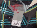 a black shirt with a green and blue plaid pattern on it