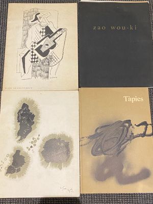 three books are sitting on a table next to each other