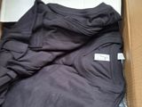 a box with a bunch of clothes inside of it