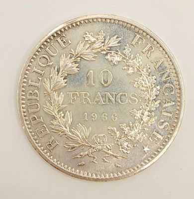 a close up of a coin on a white surface