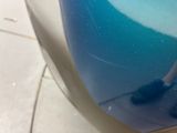 a close up view of a blue liquid on a toilet seat