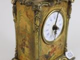 a small clock that is sitting on a table