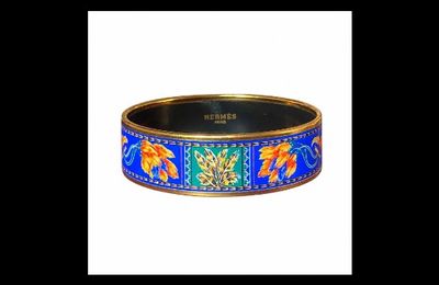 a close up of a bracelet with an elephant design on it
