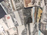 a lot of old postcards that are on the table