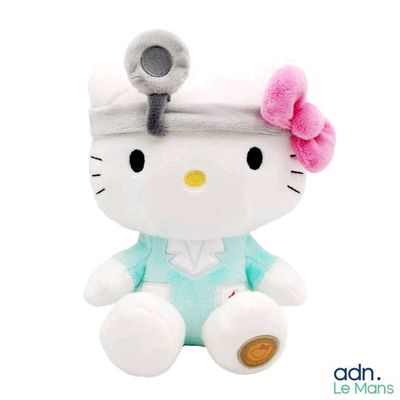hello kitty plush toy with a microphone on top of her head