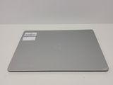 an apple macbook air laptop is sitting on a white surface