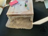 a coffee table that is sitting on a rug