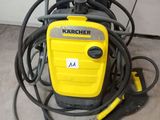 a yellow and black vacuum cleaner sitting on top of a floor next to a bunch of hoses
