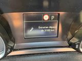 a close up of a car dashboard with a clock on it