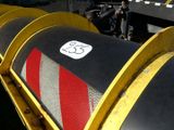 a large pipe with a number on it sitting in the middle of a field