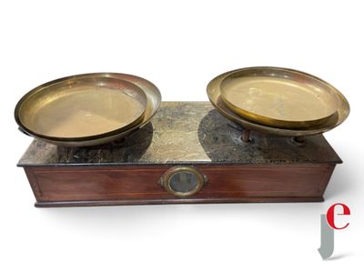two bowls sitting on top of a wooden box