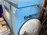 a large blue box sitting on a pallet in a warehouse