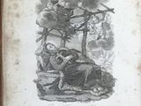 an old book with a picture of a man and a woman sitting on the ground