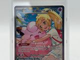 a close up of a pokemon card in a plastic case