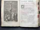 an old book with a picture of a crucif on it