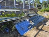 a pile of metal and wood in the middle of a field