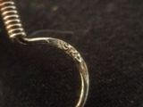 a ring that is sitting on top of a black surface