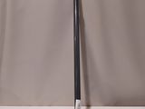 a baseball bat sitting on a table next to a ball