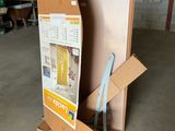 a cardboard box sitting on the floor next to a cardboard box