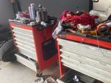 two cars that are parked in a garage