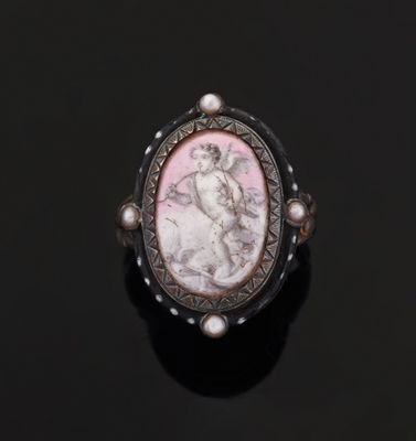 a close up of a ring with a picture of a woman on it