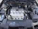 a car engine with the hood open on the street
