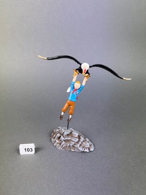 figurine of a man flying with a bird on his head