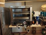 an image of a kitchen with a lot of dishes on the shelves