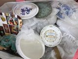 a box full of plates and bowls of food