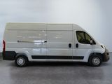 a picture of a white van parked in a room