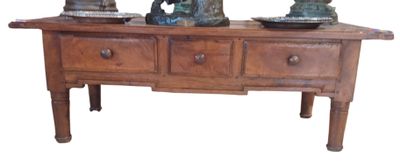 two vases sitting on top of a wooden table