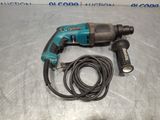 a close up of a corded drill with a cord attached to it