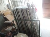 many pieces of wood stacked on top of each other in a room