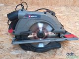 a picture of a circular saw sitting on a piece of wood
